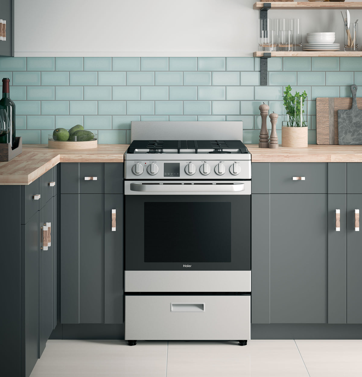 24-inch stainless steel gas range with convection and modular backguard in modern kitchen with gray cabinets and subway tile backsplash