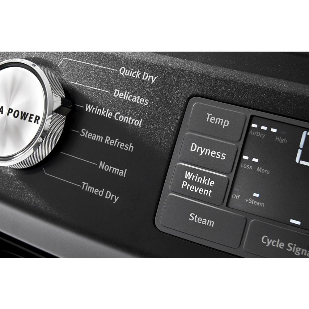 Close-up of black electric dryer control panel showing cycle options and buttons including Quick Dry and Wrinkle Prevent.