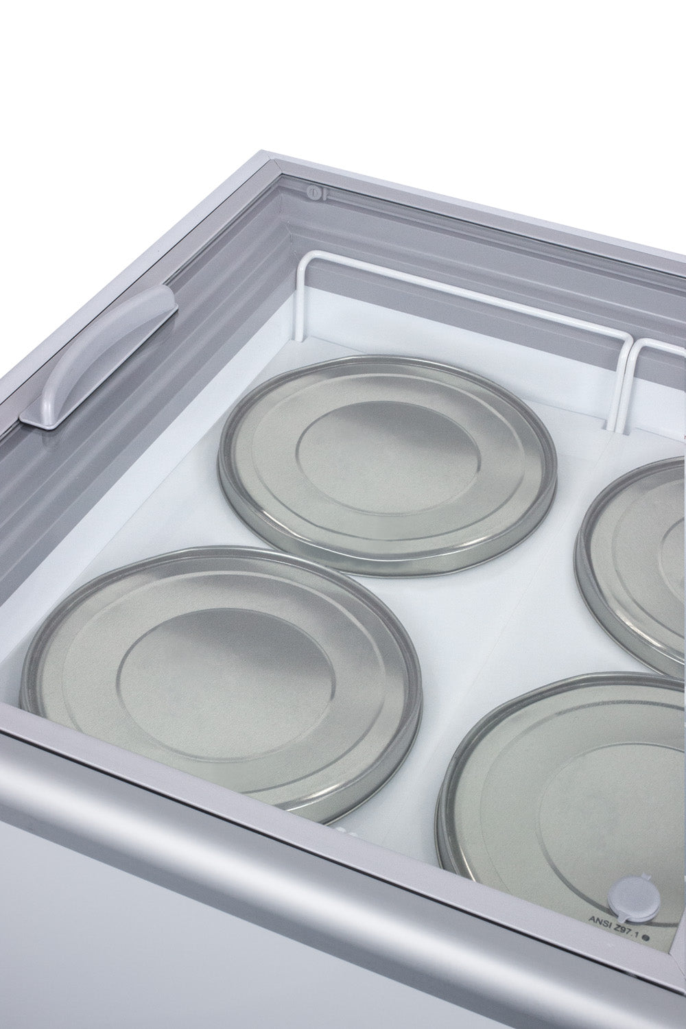 Commercial chest freezer interior with tempered glass lid and metal trays for storage in freezers collection