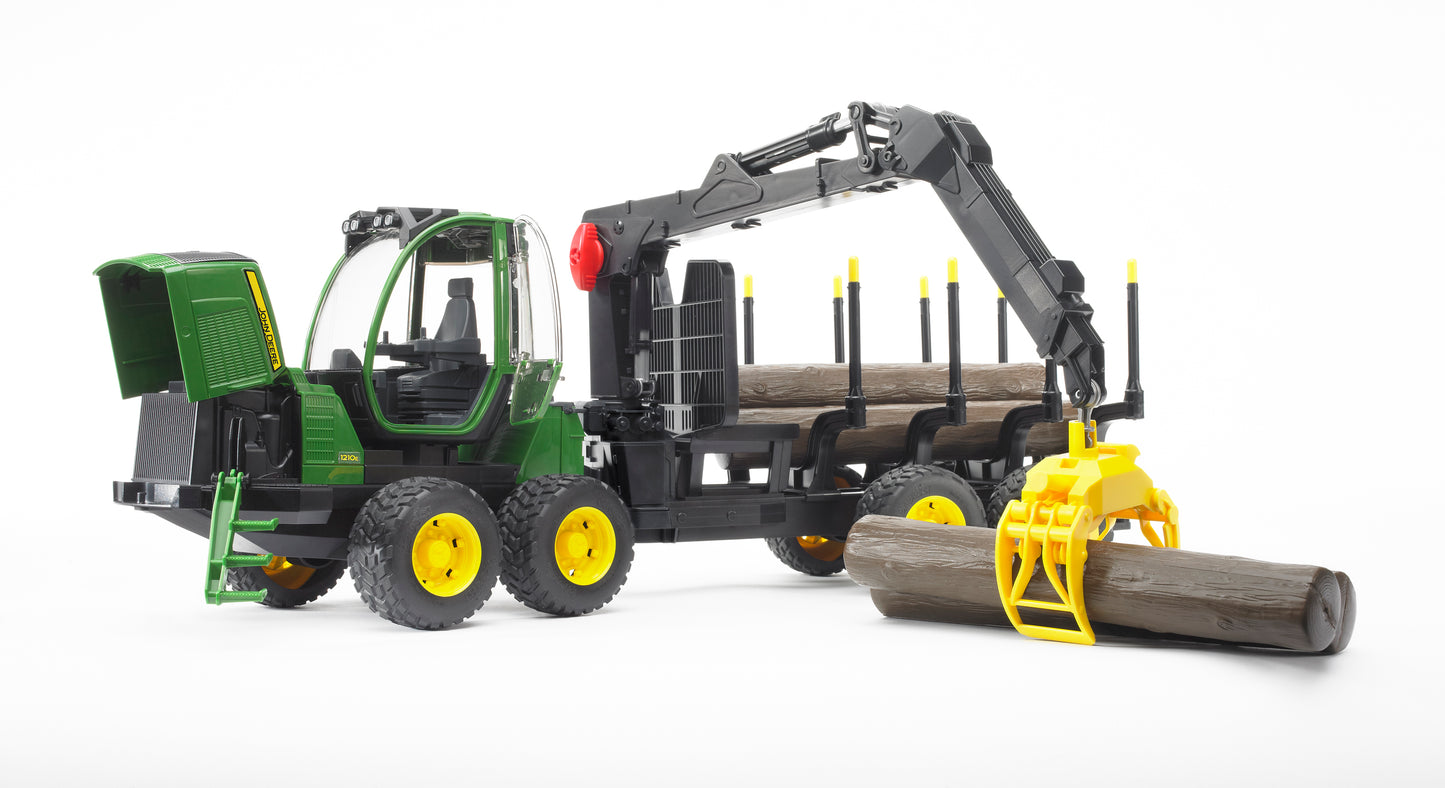 Green and yellow Bruder forwarder toy model loading wooden logs using articulated crane arm for home improvement play