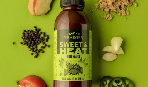 16 oz bottle of Traeger Sweet and Heat BBQ Sauce with ingredients like peppercorns and garlic for grilling and outdoor cooking under $50