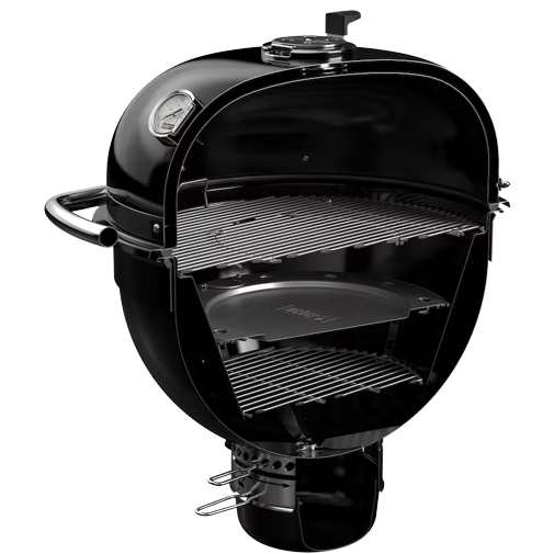 Black Kamado-style charcoal grill with insulated walls and multiple cooking racks for outdoor grilling and lawn use