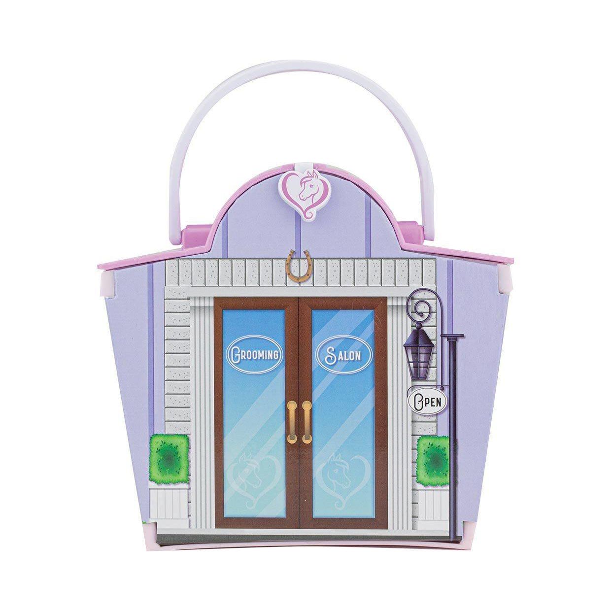 Purple and pink toy grooming salon playset with doors and molded handle for easy carrying