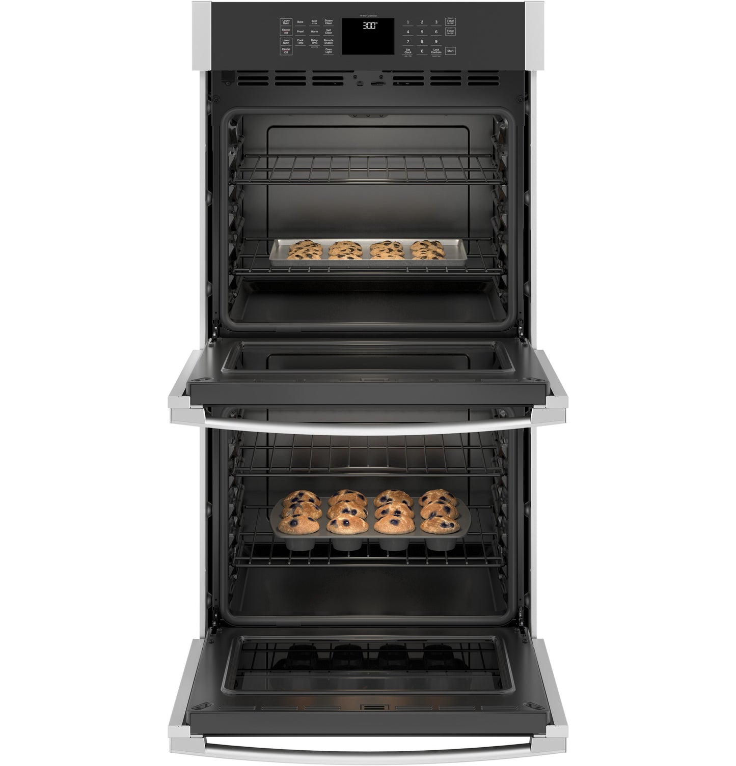 Open stainless steel double wall oven from kitchen appliances with baking trays of cookies inside both ovens