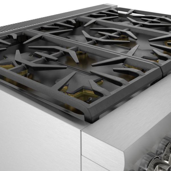 close-up of stainless steel gas range burners with cast iron grates in kitchen appliances collection