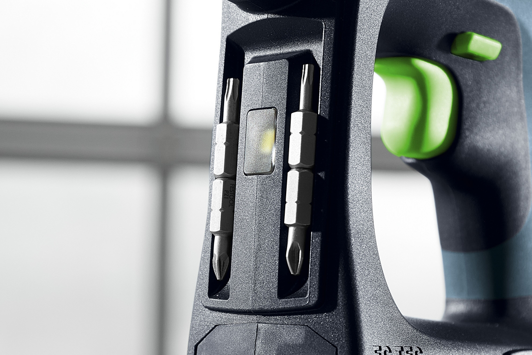 Close-up of Festool cordless drill handle with integrated dual screwdriver bit holder and LED light for woodworking tools