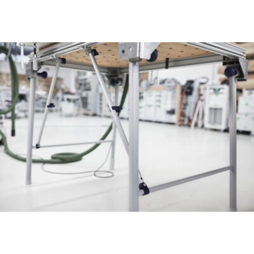 Close-up of metal cross members reinforcing a multifunction woodworking table with dust management hoses nearby