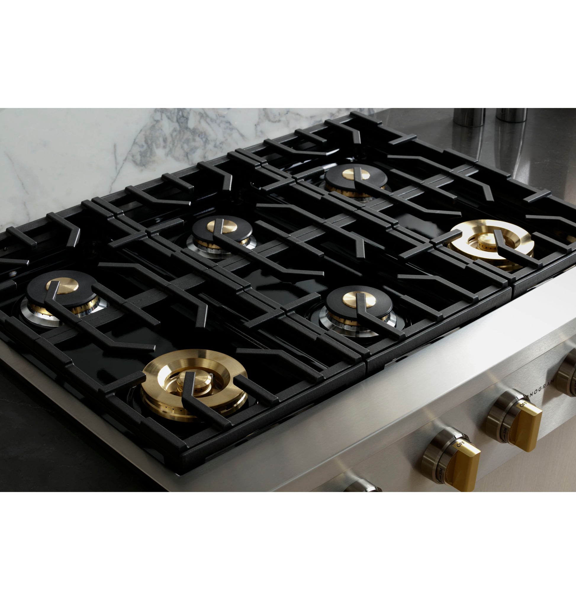 Stainless steel cooktop with six burners and brass knobs, part of Cooktops and Kitchen & Kitchenware collections