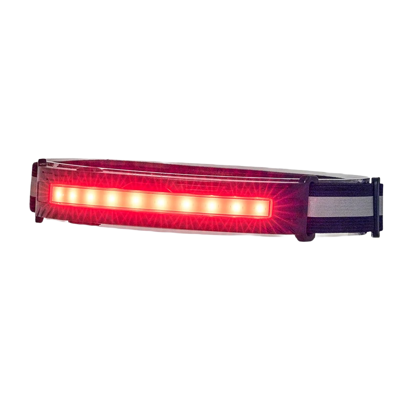 Black adjustable rechargeable headlamp with bright red LED strip for hands-free lighting in tools and home improvement tasks