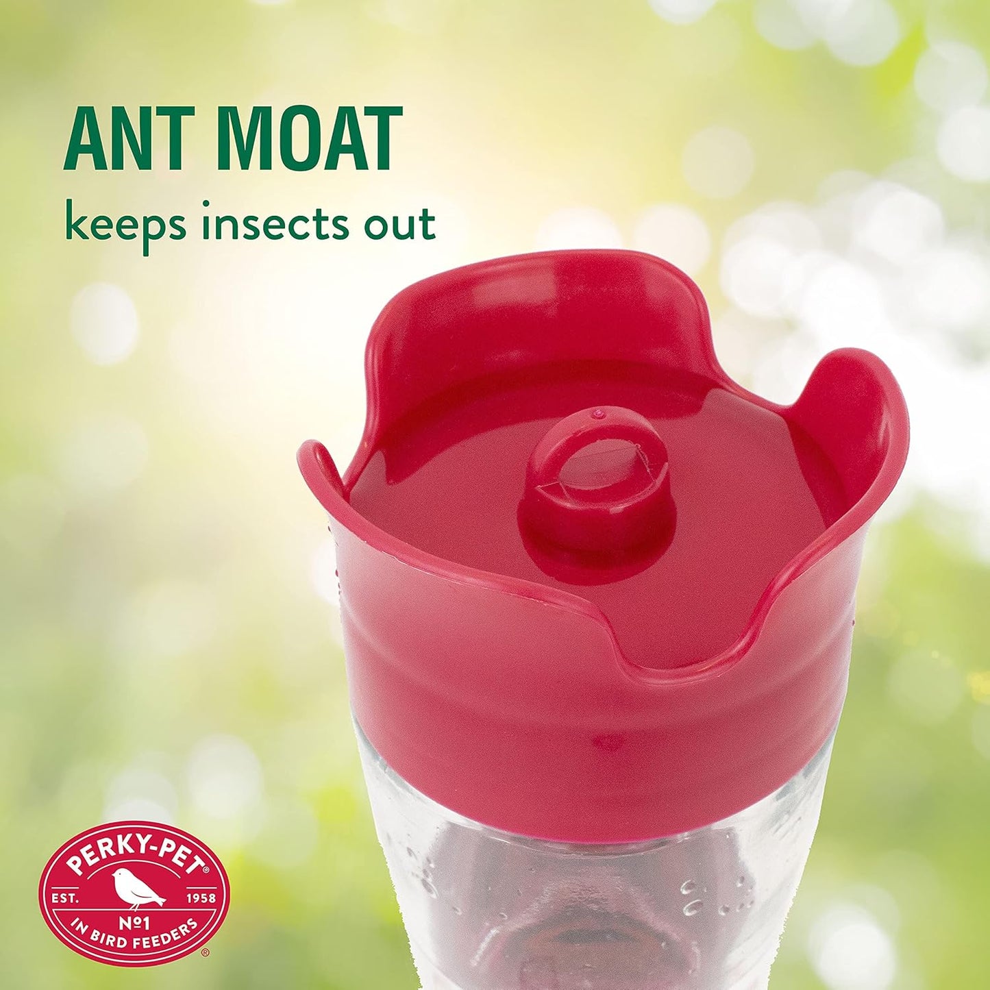 Close-up of red ant moat feature on a clear glass hummingbird feeder designed to block insects outdoors