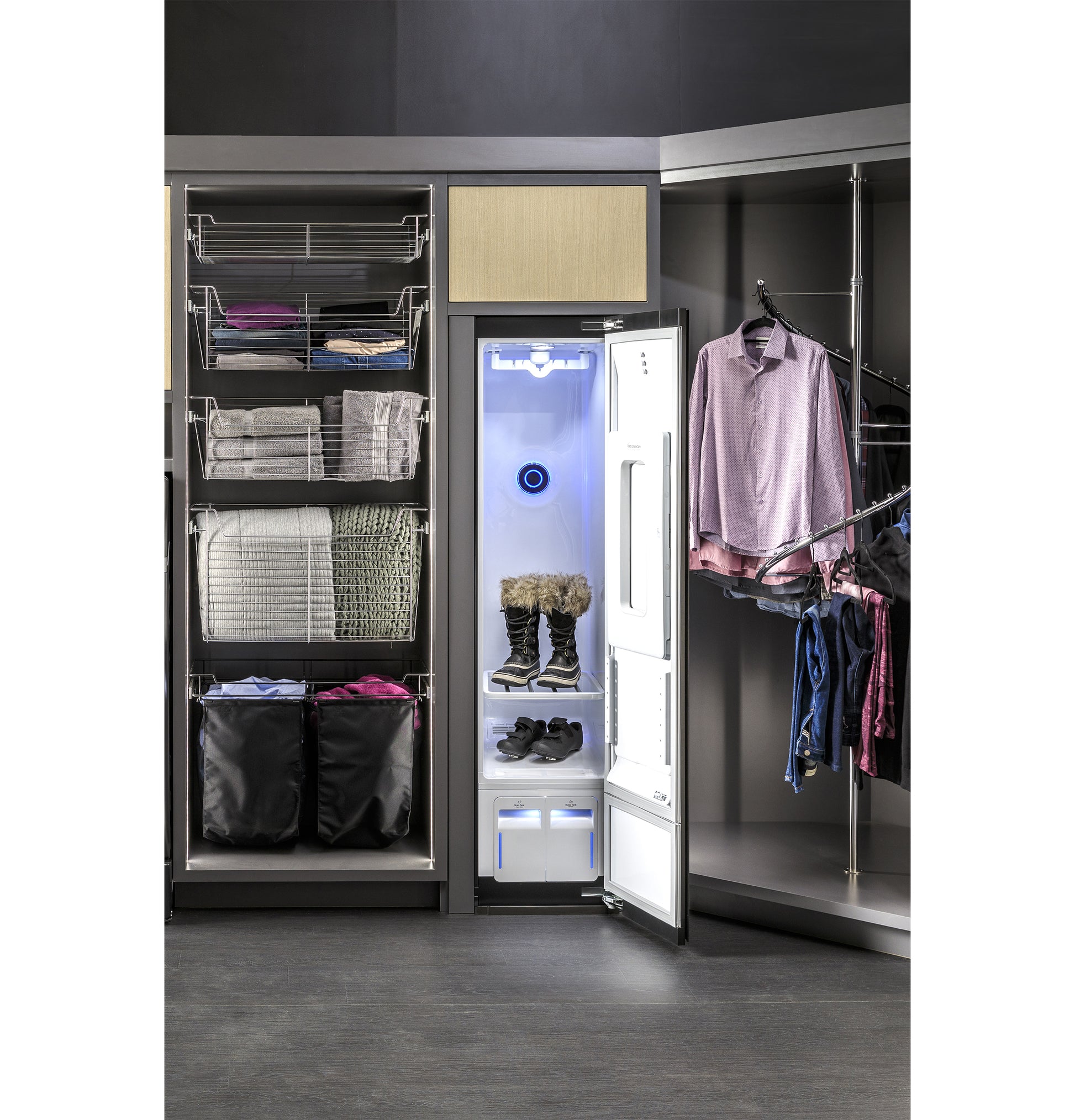 Open fabric care closet with blue LED light drying boots and shoes in modern laundry center with organized shelving and hanging clothes