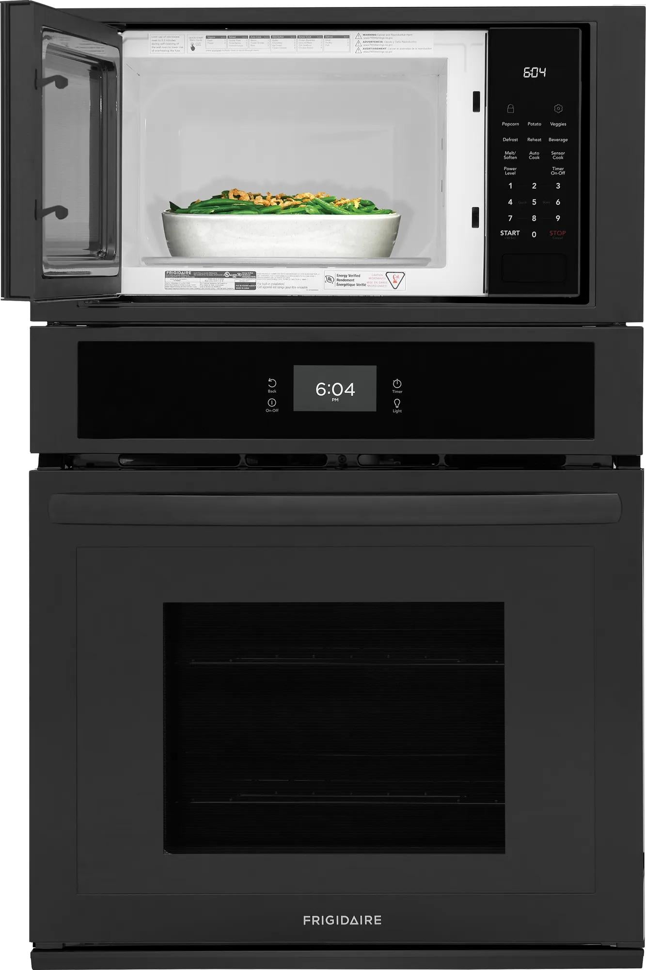 Black electric wall oven and microwave combo with digital touch controls showing time and white bowl inside microwave cavity
