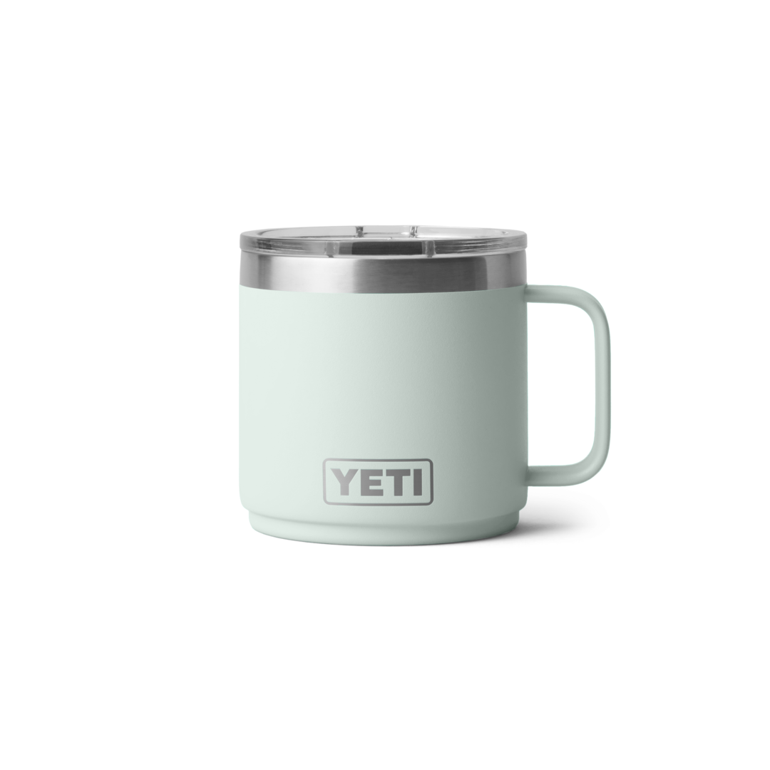 Light green insulated stackable mug with ceramic lining, clear lid, and handle for hot and cold drinks in drinkware collection
