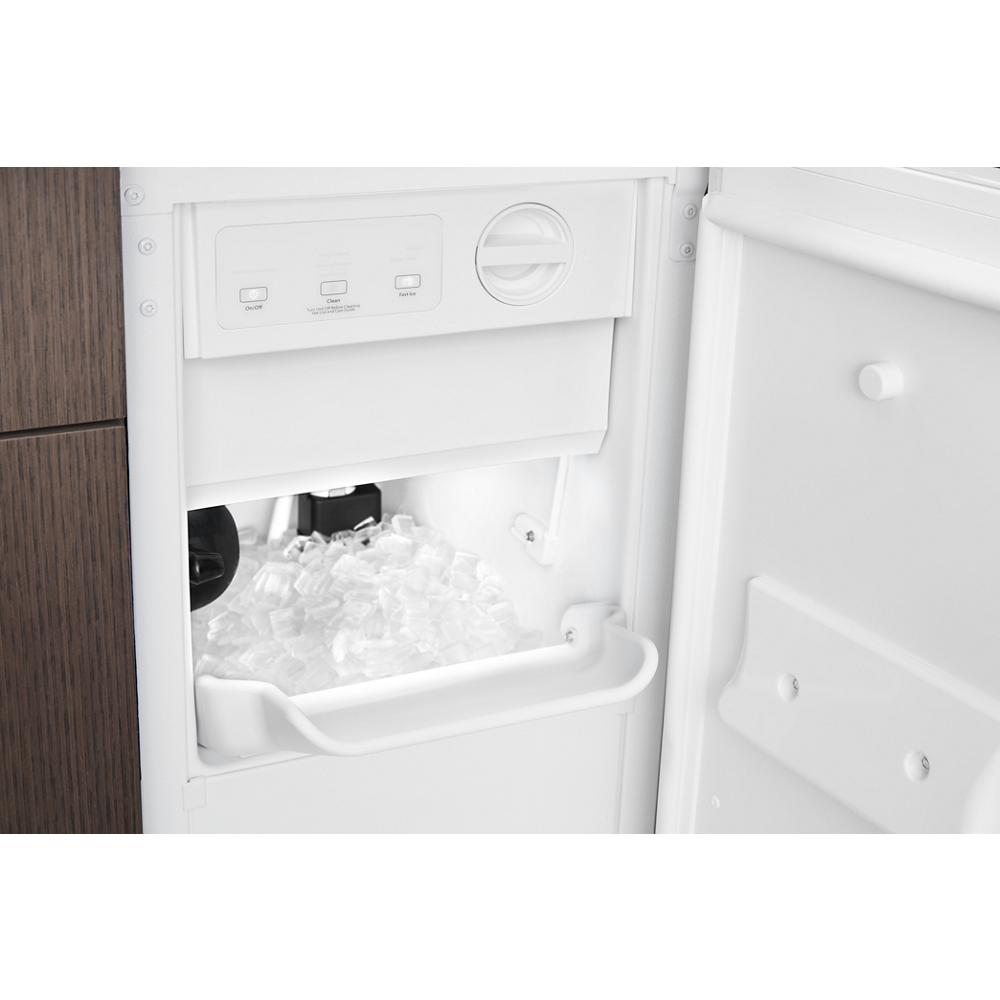 Built-in 15-inch white icemaker producing clear ice cubes with control panel, designed for kitchen appliances collections.