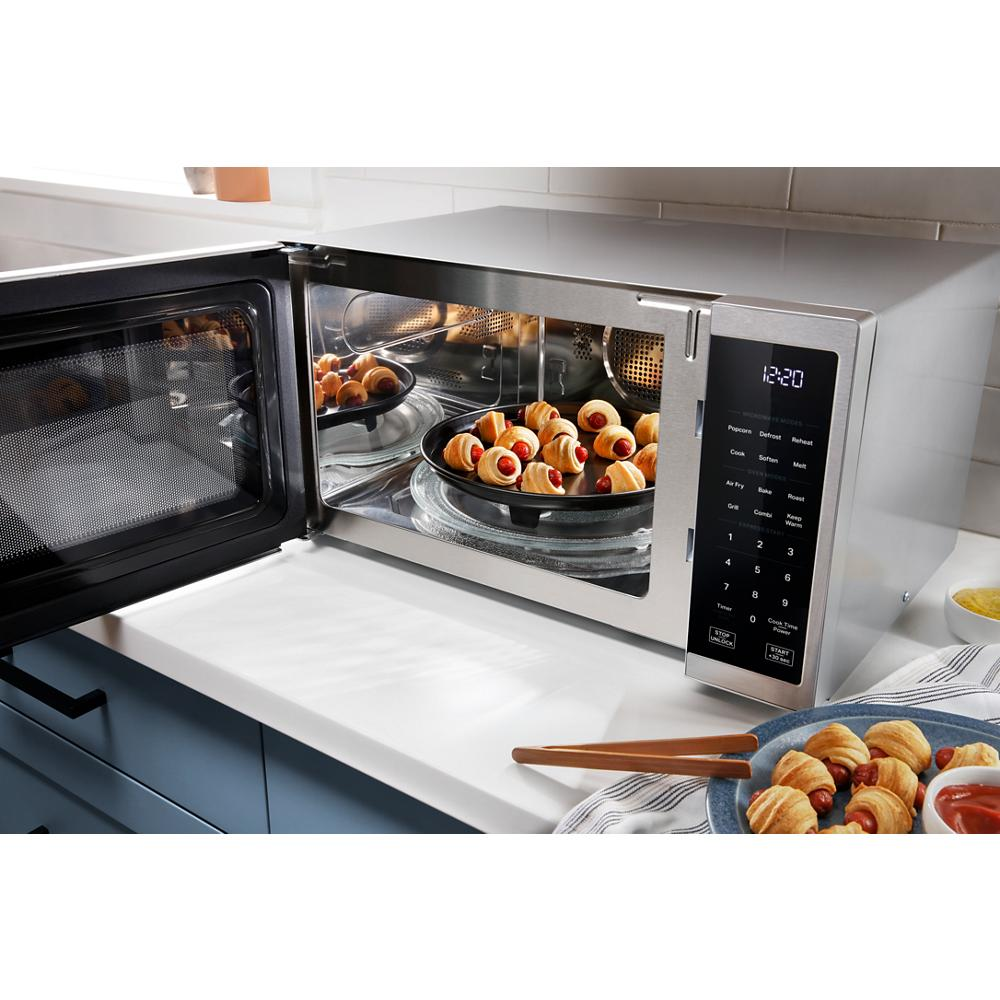 Stainless steel countertop microwave with digital control panel and air fry cooking in modern kitchen setting