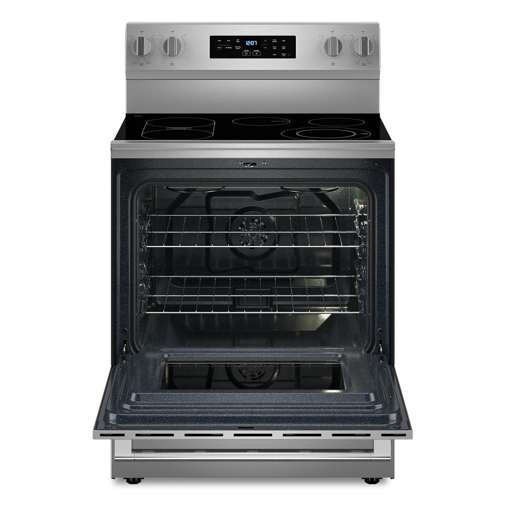 Stainless steel electric range with open door showing spacious oven interior, racks, and smooth cooktop surface