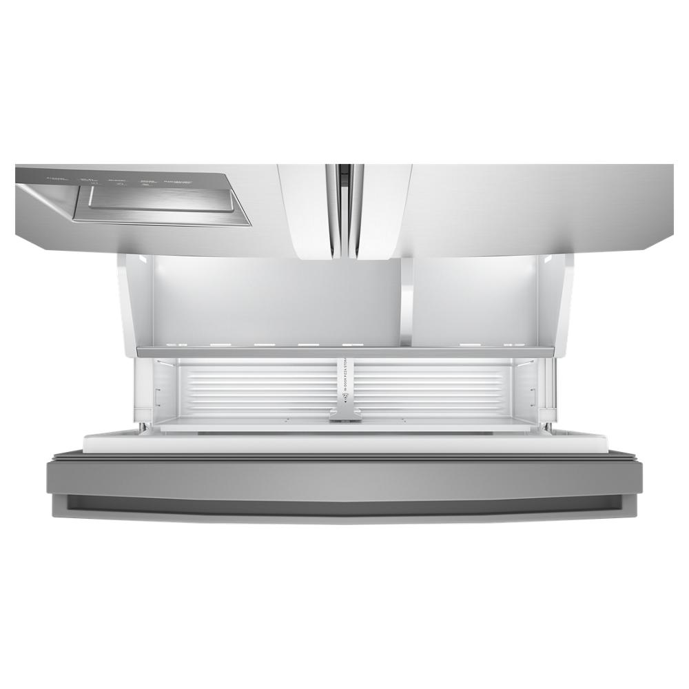 Top view of open bottom freezer compartment with spacious drawer and bright interior light in French door refrigerator