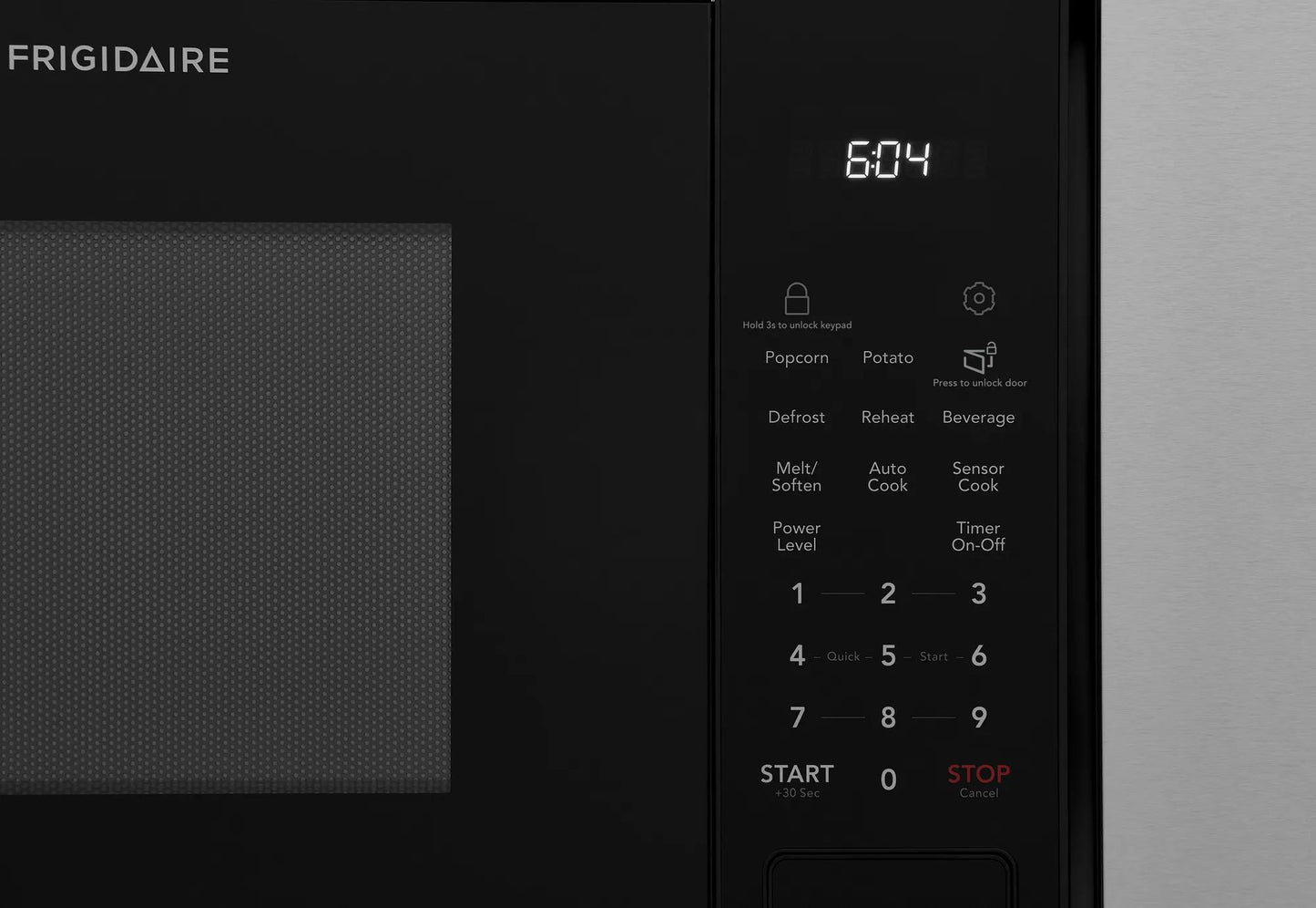 Black built-in microwave control panel with sensor cook, reheat options, and digital clock from kitchen appliances collection