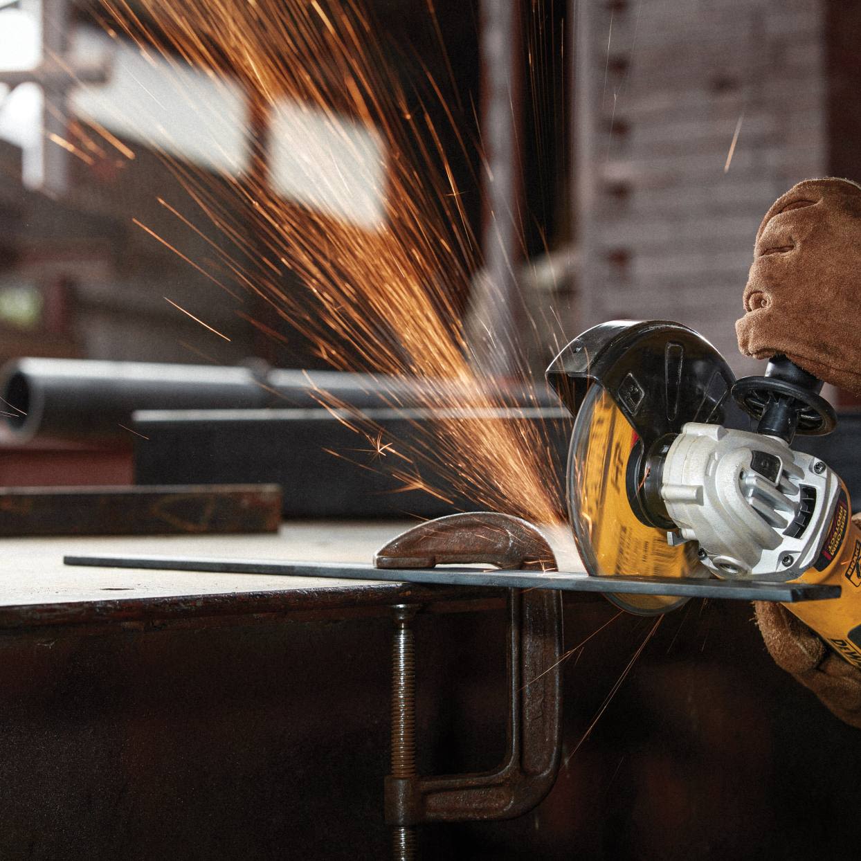 Close-up of power tool cutting metal with bright sparks flying for tools and home improvement use