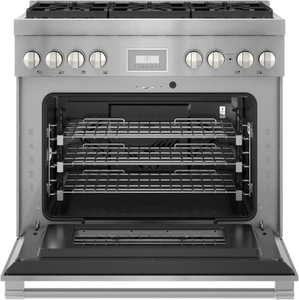 Open stainless steel professional gas range oven with three racks, control knobs, and digital display panel