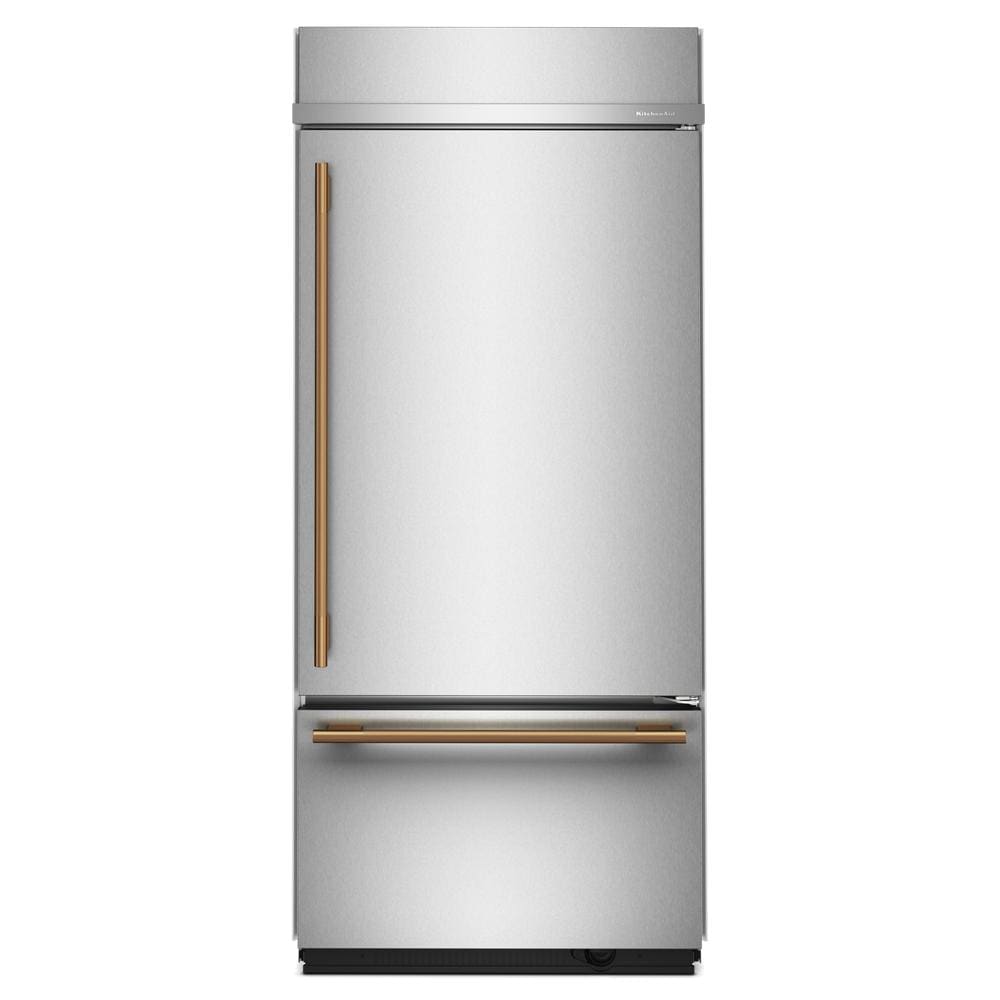 Built-in 36-inch bottom mount refrigerator with platinum finish and brushed brass handles from KitchenAid Appliances collection