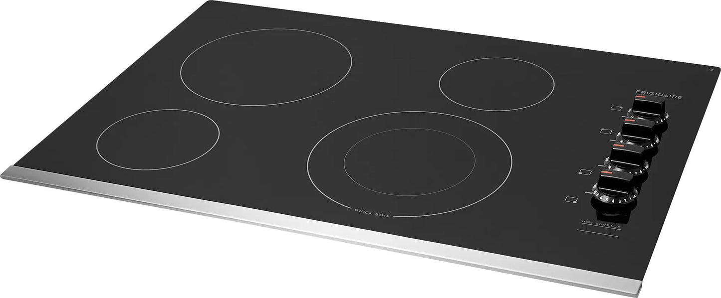Frigidaire frameless black electric cooktop with four cooking zones and stainless steel trim for kitchen appliances and home improvement