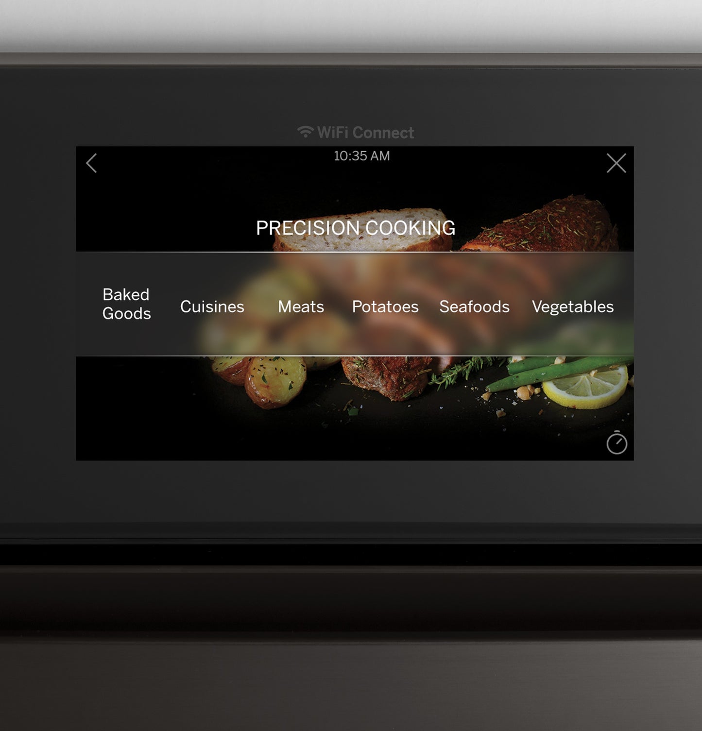 Touchscreen control panel displaying precision cooking menu with options for meats, vegetables, seafood, and baked goods