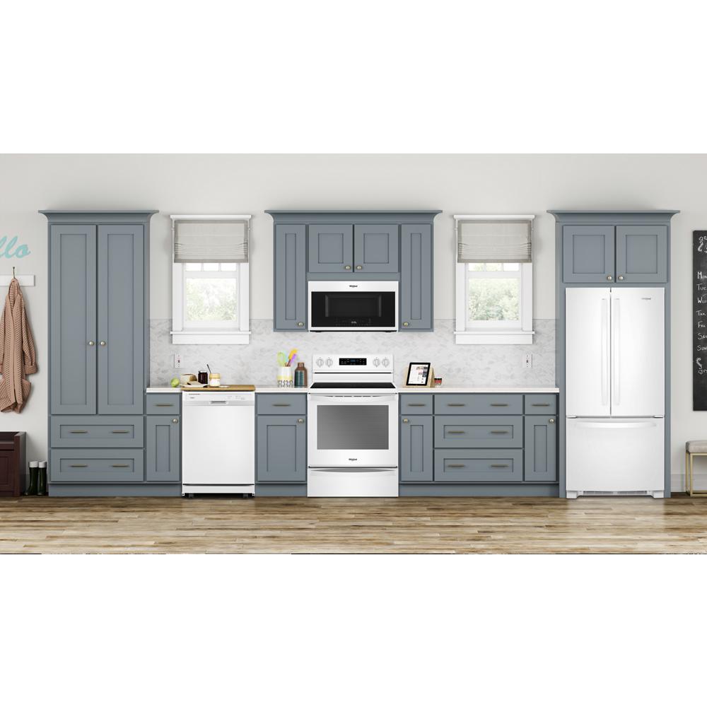 Modern kitchen setup with white heavy-duty dishwasher, stainless steel appliances, and blue cabinetry in home improvement collection
