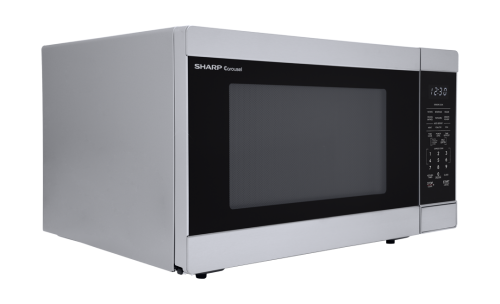 Stainless steel countertop microwave with digital control panel and LED clock in kitchen appliances collection