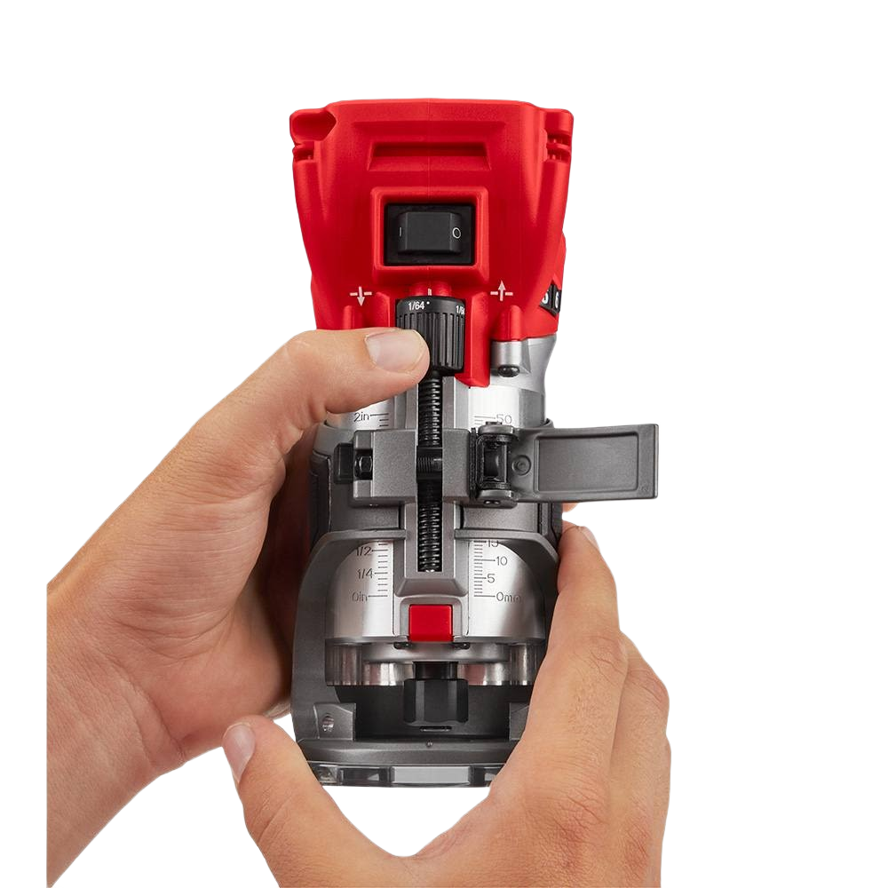 Compact red and black cordless trim router being adjusted by hands for precision woodworking tasks in home improvement