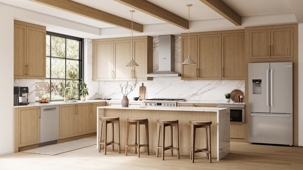 Modern kitchen featuring light wood cabinetry and a stainless steel French door refrigerator from Bosch appliances collection