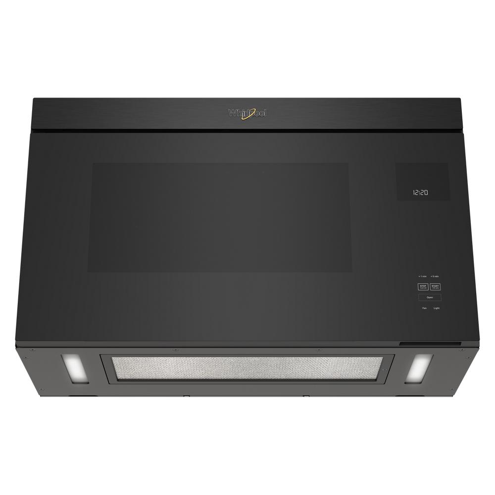 Black flush mount microwave with digital display and smooth interior, designed for seamless kitchen integration in Appliances collection
