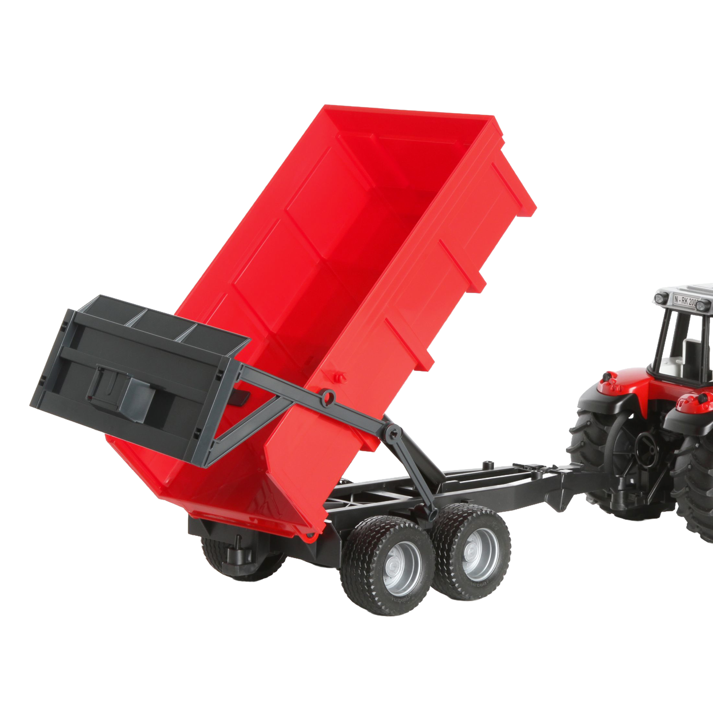 Red dumping trailer raised behind detailed red tractor toy from Bruder Toys in Vehicles & Remote Controlled Toys collection