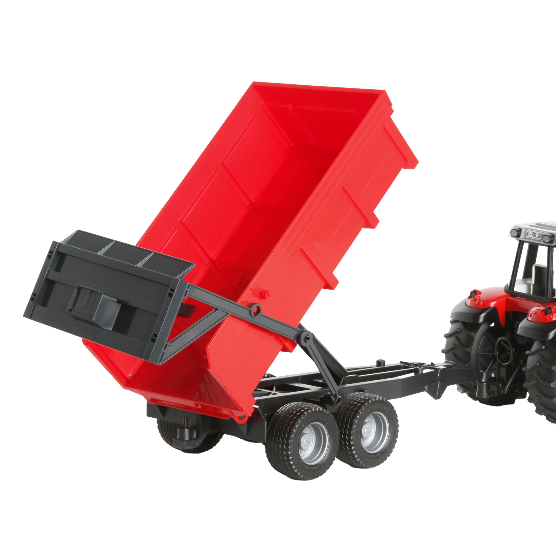 Red dumping trailer raised behind detailed red tractor toy from Bruder Toys in Vehicles & Remote Controlled Toys collection