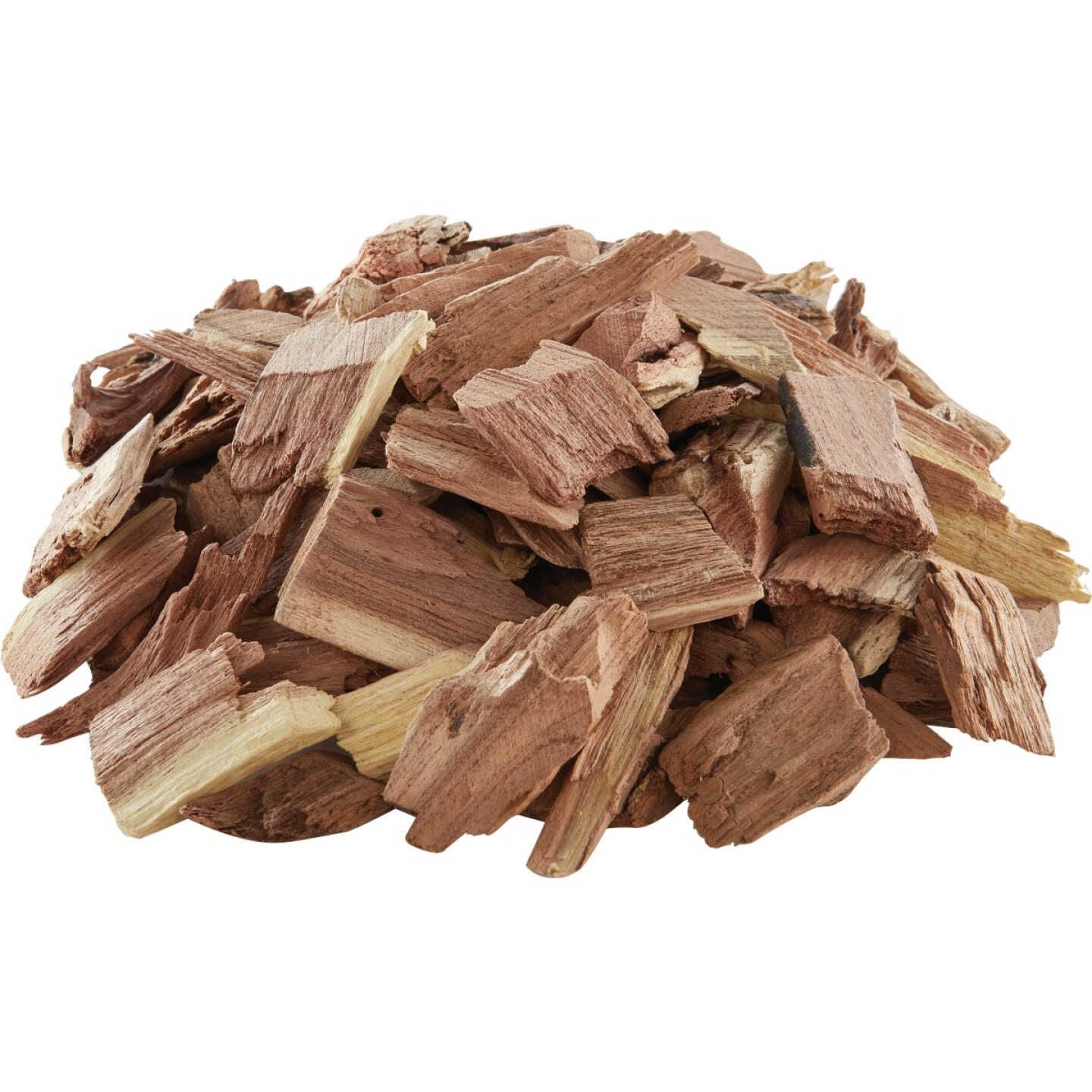 Pile of natural mesquite wood chips used for enhancing grilled and smoked foods in home improvement cooking tasks
