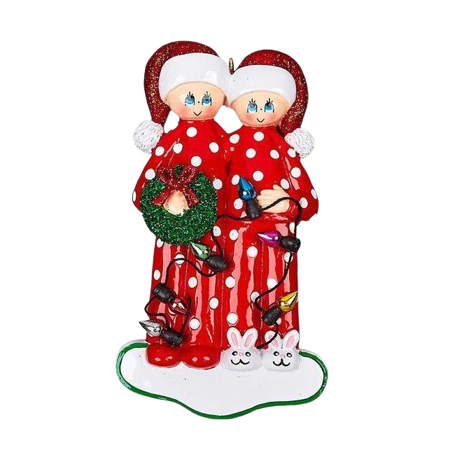 Couple in red polka-dot pajamas with Santa hats holding wreath wrapped in colorful Christmas lights under $50 collection