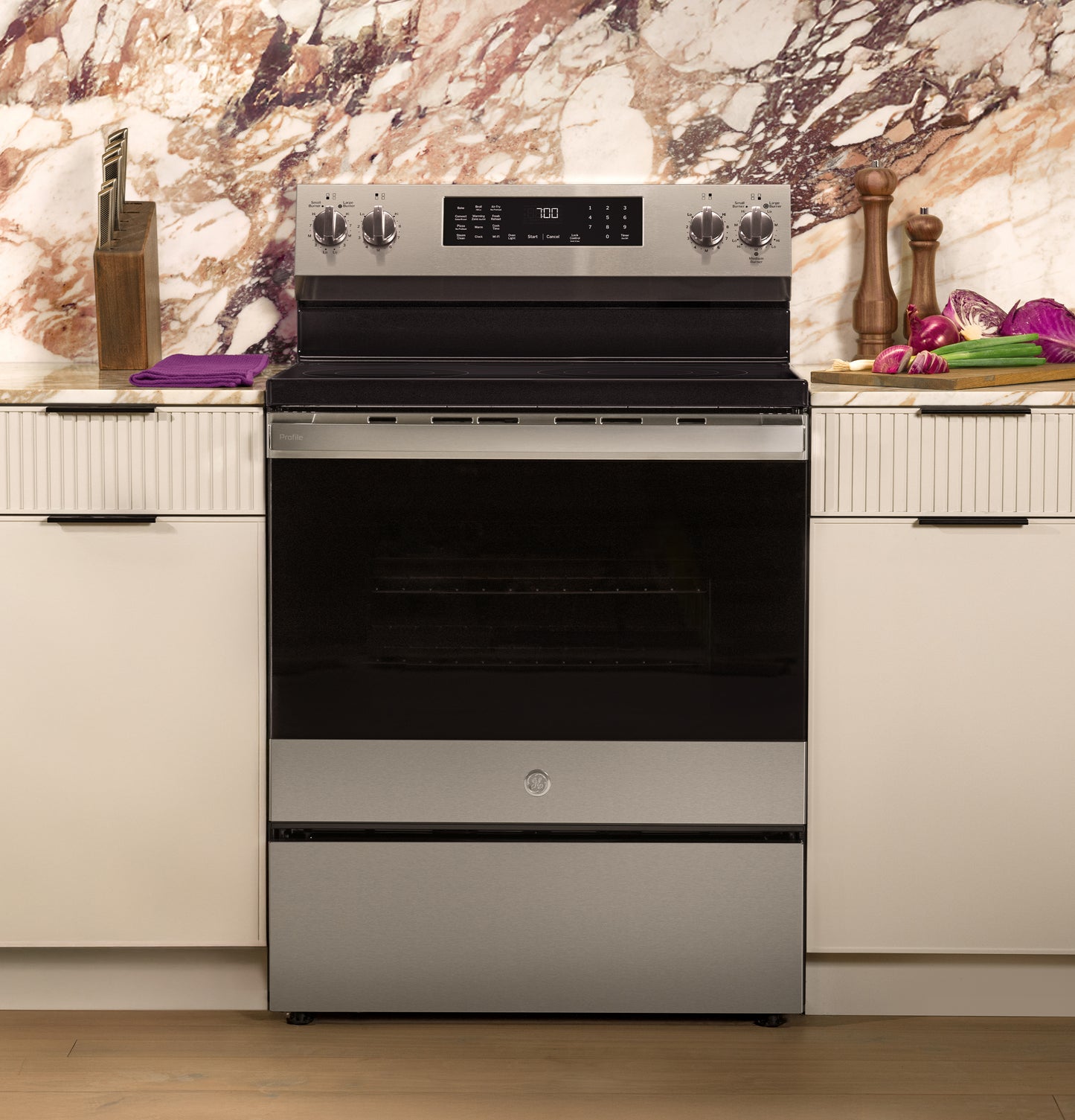 Stainless steel smart electric range with digital display set in modern kitchen, part of ranges and kitchen appliances collections