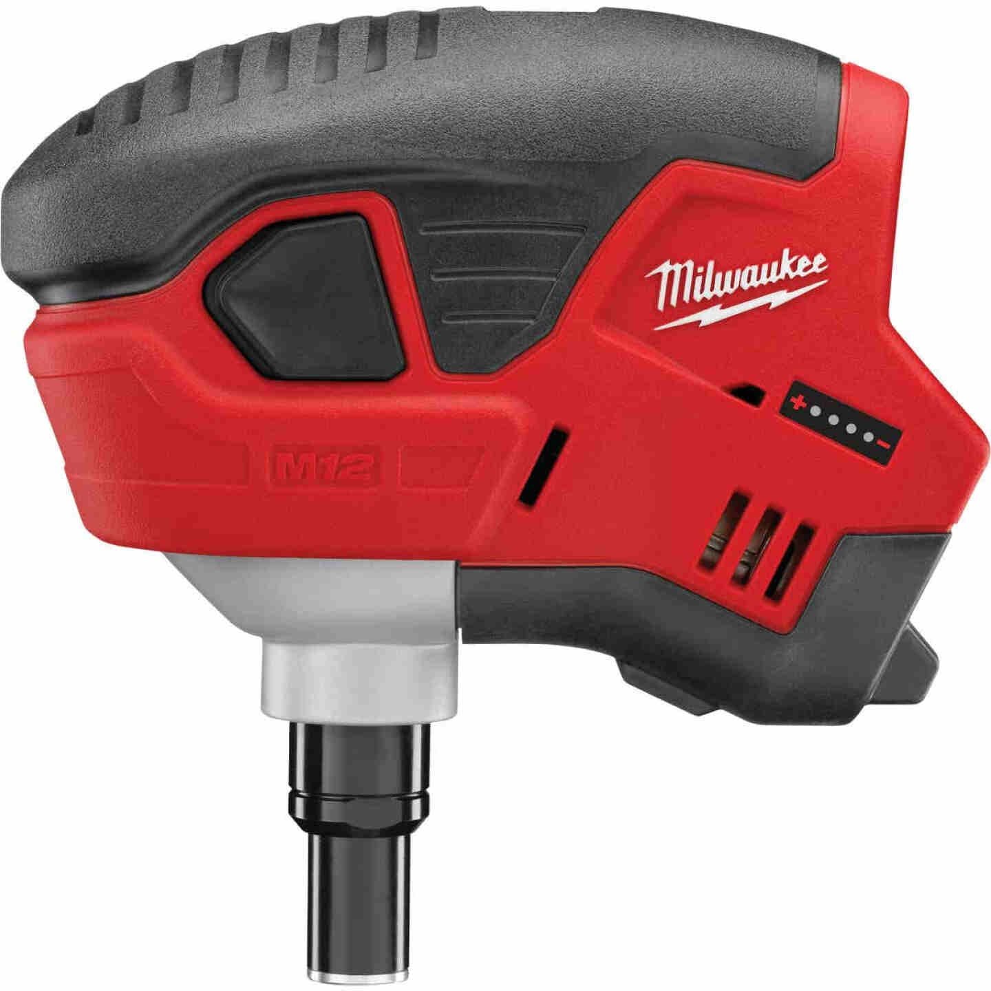 Compact Milwaukee cordless palm nailer with ergonomic grip for efficient home improvement projects