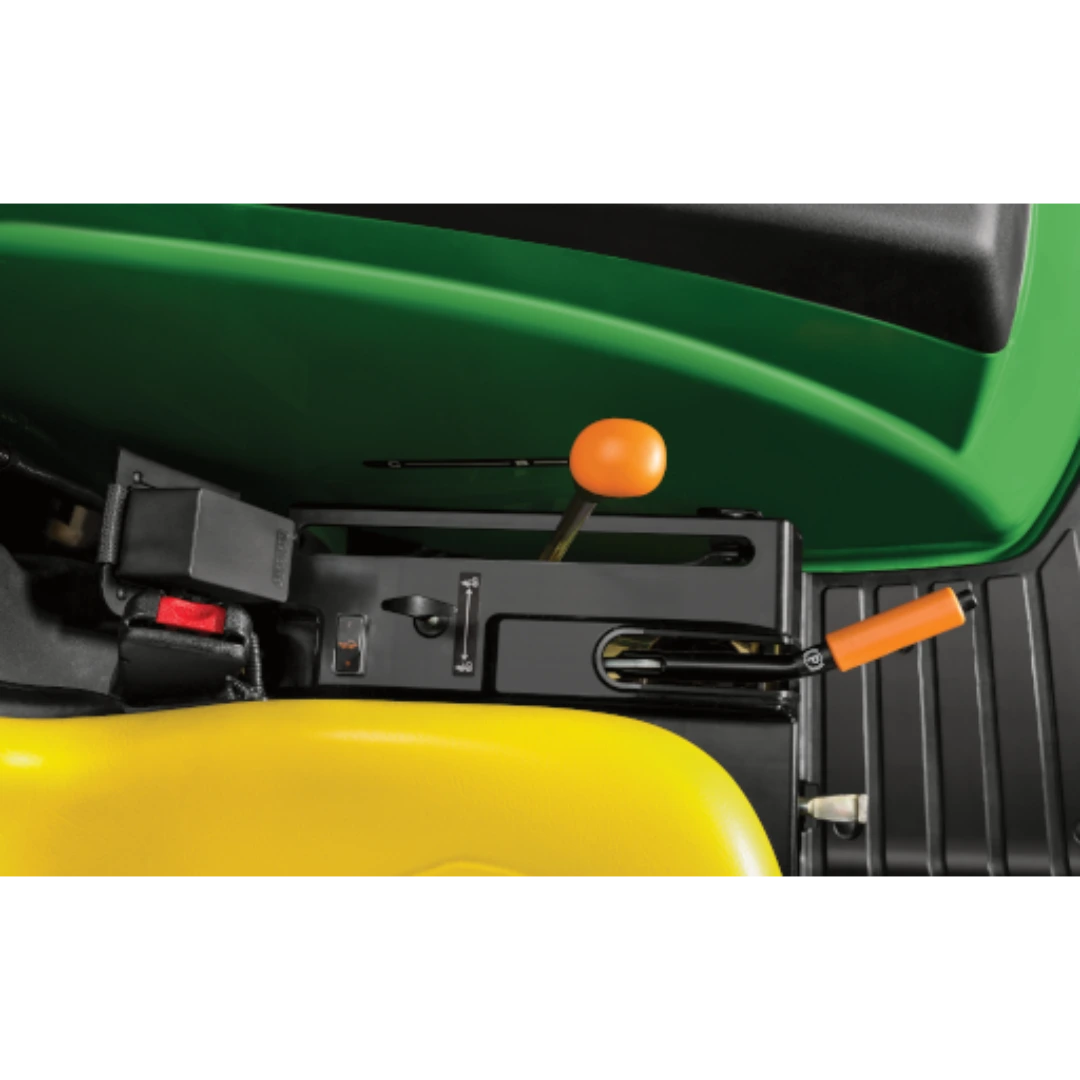 Close-up of orange control levers and yellow seat in the operator area of a John Deere 4044R Compact Tractor, featured in Outdoor Power Equipment at Hartville Hardware.