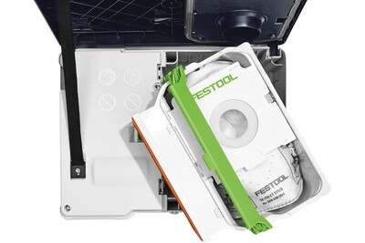 Open Festool dust extractor showing HEPA-Plus filter and dust collection bag inside for woodworking tools