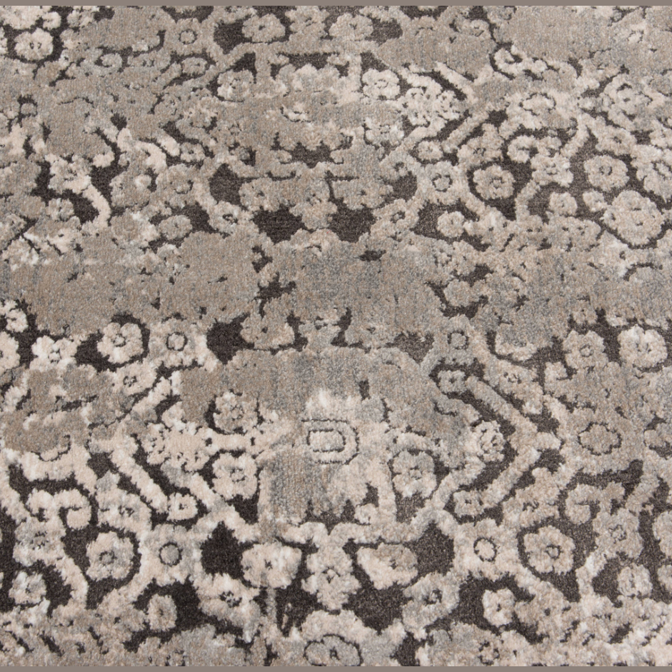 Area rug with abstract brown and cream pattern featuring textured, artistic designs for stylish floor decor
