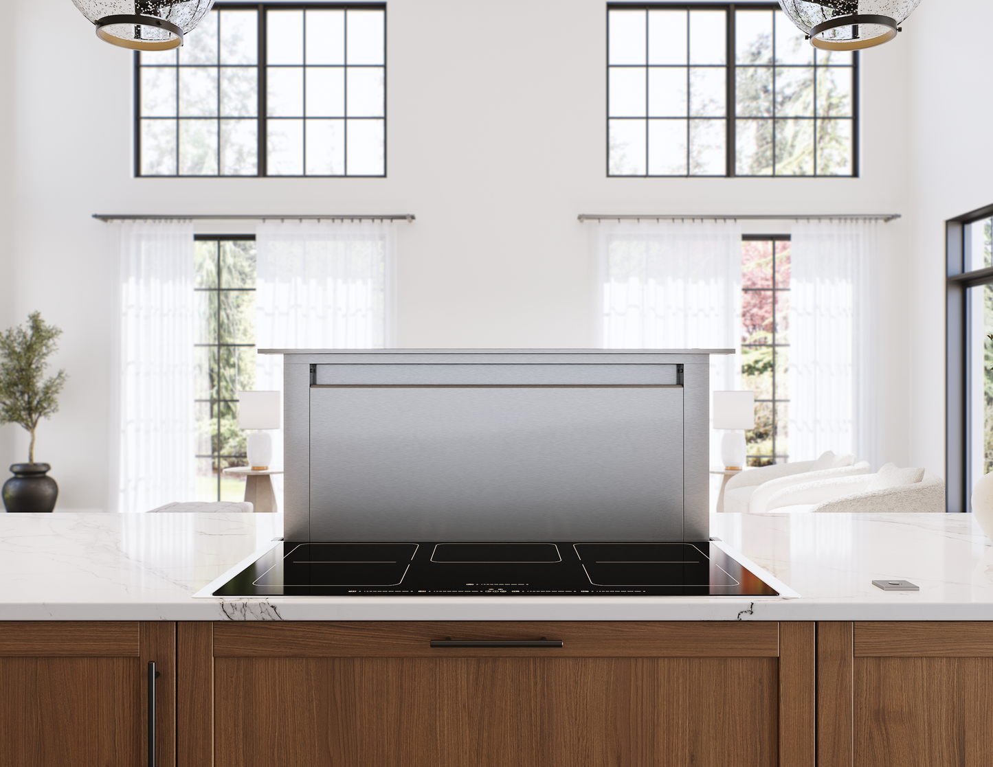 Stainless steel hidden downdraft vent integrated into modern kitchen island in range hoods and appliances collection