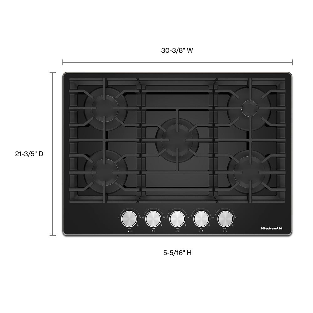 Top view of black KitchenAid five-burner gas cooktop with control knobs and cast iron grates in appliances collection
