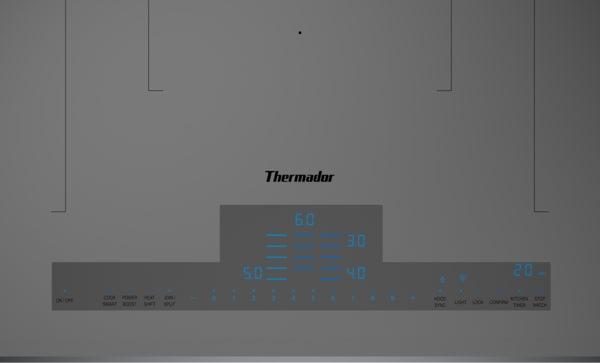 Titanium gray induction cooktop digital control panel with blue illuminated touch buttons in kitchen appliances collection
