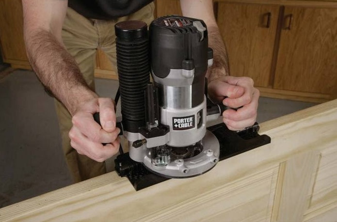 Person using Porter-Cable woodworking tool accessory for door latch installation in home improvement woodworking tools collection