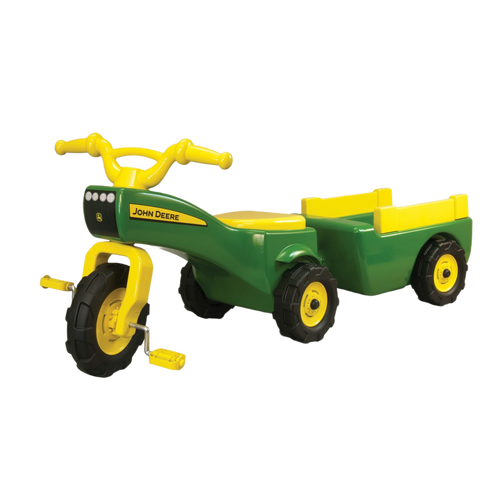 Green and yellow pedal tractor with detachable wagon toy featuring John Deere branding on front panel