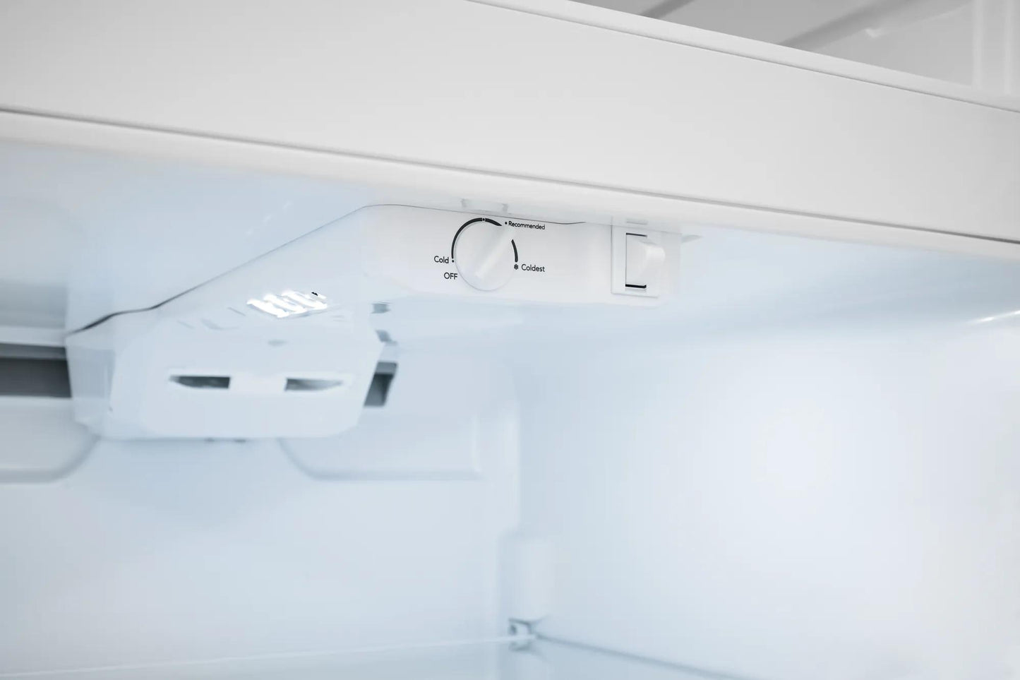 Interior view of refrigerator with temperature control dial and LED lighting from Appliances collection
