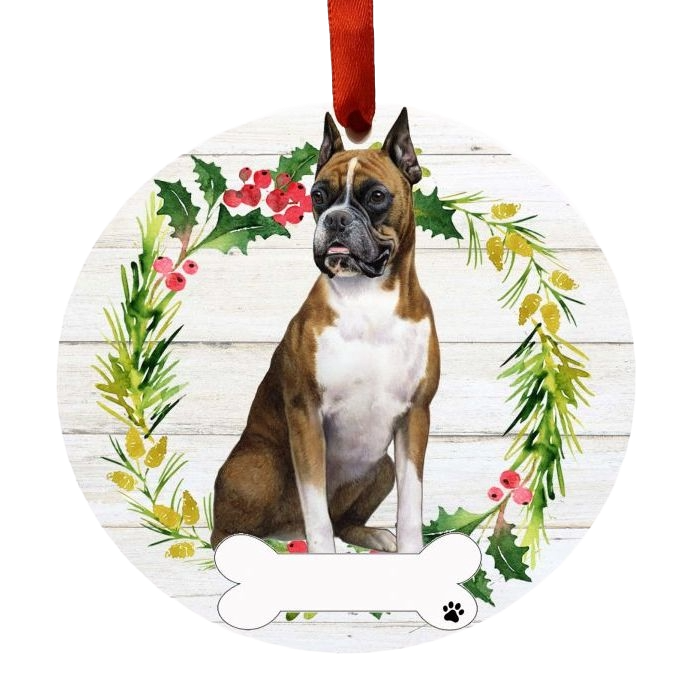 Round Christmas ornament featuring a Boxer dog sitting inside a festive holly and pine wreath design