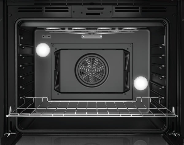 Interior view of black stainless steel single wall oven with convection fan and oven light from Bosch kitchen appliances collection