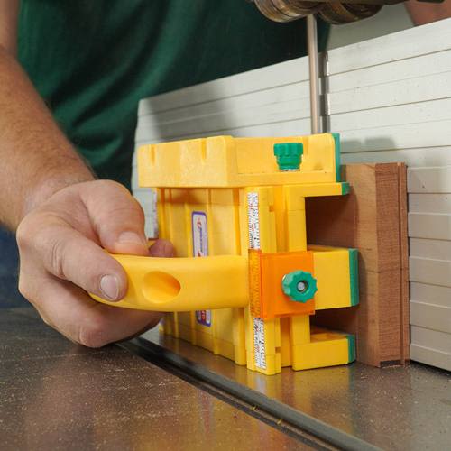 Yellow push block with adjustable guides and measurement scale for precise cutting in saw and power tool accessories collections